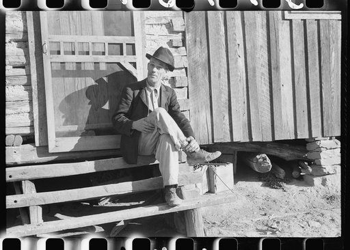 Untitled photo, possibly related to: Noah Garland sitting on the steps of his son's home, Southern Appalachian Project, near Barbourville, Knox County, Kentucky