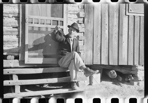 Untitled photo, possibly related to: Noah Garland sitting on the steps of his son's home, Southern Appalachian Project, near Barbourville, Knox County, Kentucky