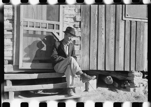 Untitled photo, possibly related to: Noah Garland sitting on the steps of his son's home, Southern Appalachian Project, near Barbourville, Knox County, Kentucky