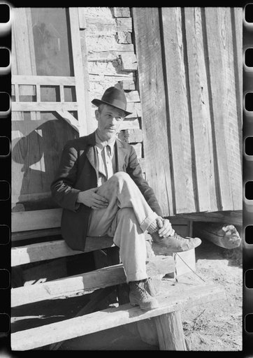 Untitled photo, possibly related to: Noah Garland sitting on the steps of his son's home, Southern Appalachian Project, near Barbourville, Knox County, Kentucky