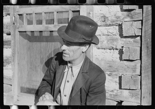 Untitled photo, possibly related to: Noah Garland sitting on the steps of his son's home, Southern Appalachian Project, near Barbourville, Knox County, Kentucky