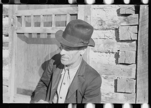 Untitled photo, possibly related to: Noah Garland sitting on the steps of his son's home, Southern Appalachian Project, near Barbourville, Knox County, Kentucky