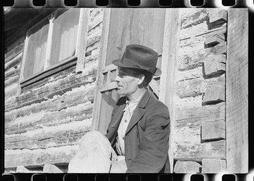 Untitled photo, possibly related to: Noah Garland sitting on the steps of his son's home, Southern Appalachian Project, near Barbourville, Knox County, Kentucky