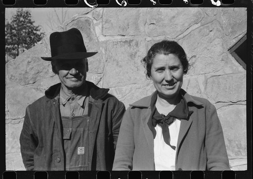 Untitled photo, possibly related to: Mr. and Mrs. S. Castle or Mr. and Mrs. William S. Allen standing before their new storage house. Southern Appalachian Project, near Barbourville, Knox County, Kentucky. Mr. and Mrs. S.W. Castle, in front of his new storage house her husband built on their farm, w