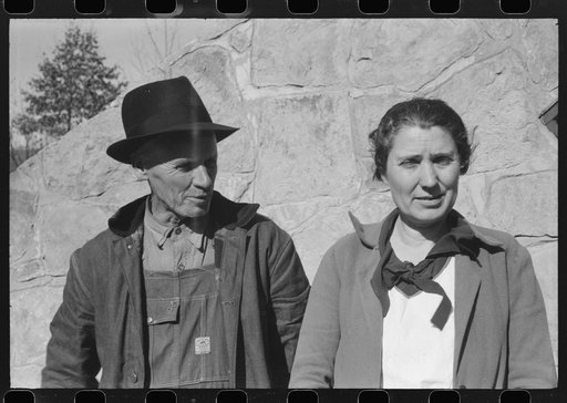 Untitled photo, possibly related to: Mr. and Mrs. S. Castle or Mr. and Mrs. William S. Allen standing before their new storage house. Southern Appalachian Project, near Barbourville, Knox County, Kentucky. Mr. and Mrs. S.W. Castle, in front of his new storage house her husband built on their farm, w