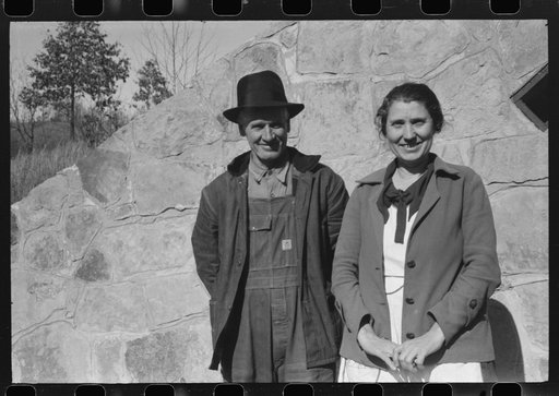Mr. and Mrs. S. Castle or Mr. and Mrs. William S. Allen standing before their new storage house. Southern Appalachian Project, near Barbourville, Knox County, Kentucky. Mr. and Mrs. S.W. Castle, in front of his new storage house her husband built on their farm, with FSA (Farm Security Administration