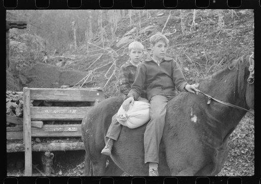 FSA (Farm Security Administration) borrower's children returning home on muleback with a sack of meal. Knox County, Kentucky
