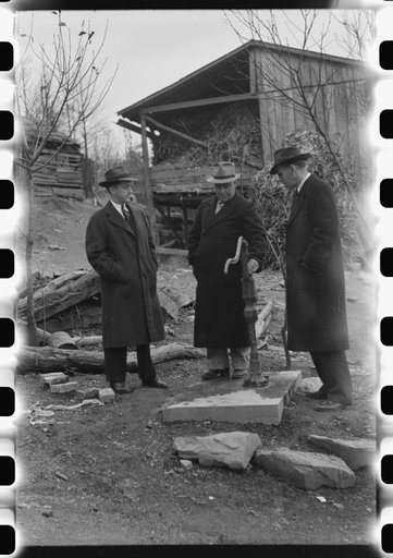 Untitled photo, possibly related to: Dr. R.B. Fulks, county health officer, John E. Hale, contractor and builder of sanitary units, and B.H. Pitt, inspector of sanitary units, making a sanitation inspection on the farm of Hobert Hammons, FSA (Farm Security Administration) borrower. Southern Appalach