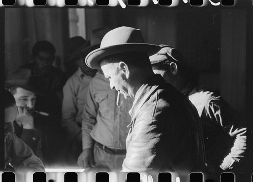 Untitled photo, possibly related to: Fur buyers and trappers waiting for FSA (Farm Security Administration) supervisor to open the bids at auction sale of muskrats in dancehall on Delacroix Island, Louisiana. See general caption no. 1