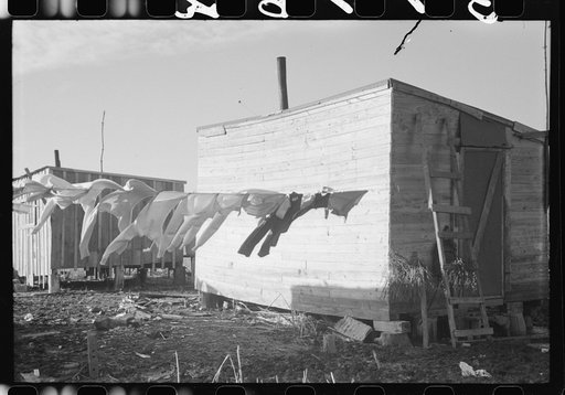 Untitled photo, possibly related to: Spanish trappers' children playing in front of their camp in the marshes near Delacroix Island, Louisiana. See general caption no. 1