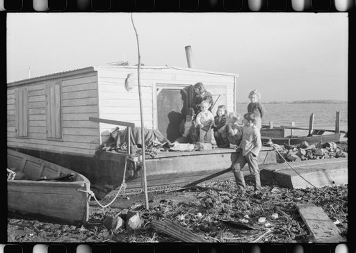 Untitled photo, possibly related to: Spanish trappers' children playing in front of their camp in the marshes near Delacroix Island, Louisiana. See general caption no. 1
