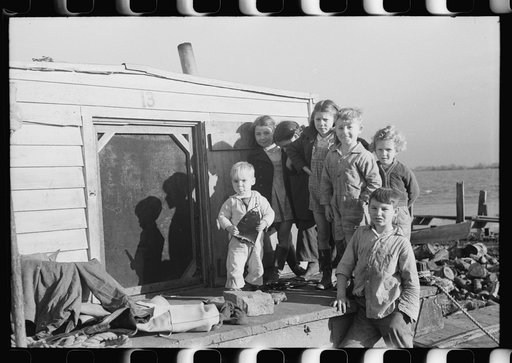 Untitled photo, possibly related to: Spanish trappers' children playing in front of their camp in the marshes near Delacroix Island, Louisiana. See general caption no. 1