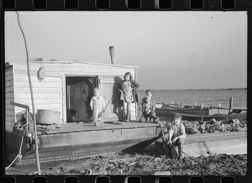 Untitled photo, possibly related to: Spanish trappers' children playing in front of their camp in the marshes near Delacroix Island, Louisiana. See general caption no. 1