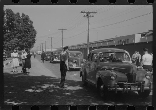 Untitled photo, possibly related to: East Hartford, Connecticut. Congestion outside the Pratt and Whitney United aircraft plant at the afternoon change of shift