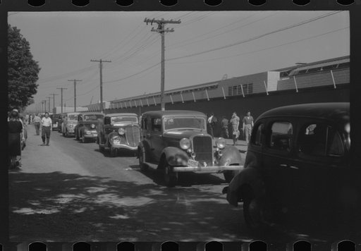 Untitled photo, possibly related to: East Hartford, Connecticut. Congestion outside the Pratt and Whitney United aircraft plant at the afternoon change of shift