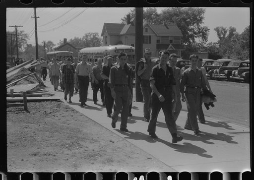 Workers entering plant at afternoon change of shift. Pratt and Whitney plant, United Aircraft, East Hartford, Connecticut