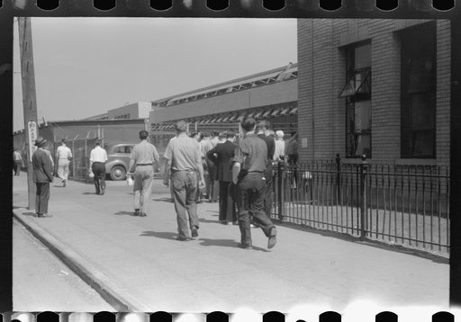 Workers entering plant at afternoon change of shift. Pratt and Whitney plant, United Aircraft, East Hartford, Connecticut