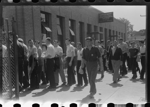 Workers entering plant at afternoon change of shift. Pratt and Whitney plant, United Aircraft, East Hartford, Connecticut