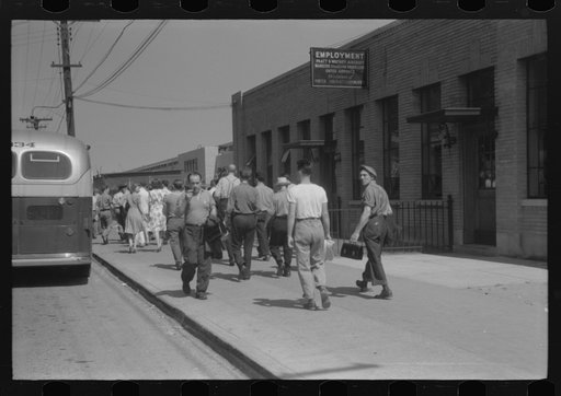 Workers entering plant at afternoon change of shift. Pratt and Whitney plant, United Aircraft, East Hartford, Connecticut