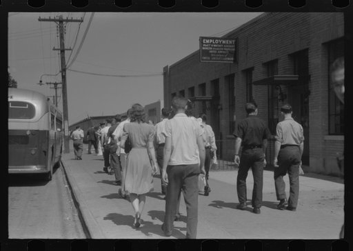 Workers entering plant at afternoon change of shift. Pratt and Whitney plant, United Aircraft, East Hartford, Connecticut