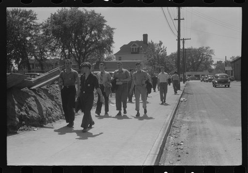Workers entering plant at afternoon change of shift. Pratt and Whitney plant, United Aircraft, East Hartford, Connecticut