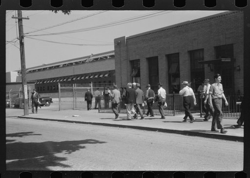 Workers entering plant at afternoon change of shift. Pratt and Whitney plant, United Aircraft, East Hartford, Connecticut
