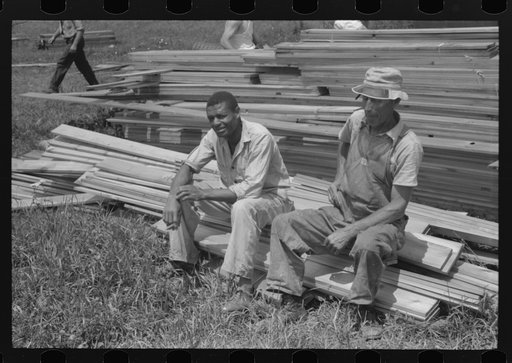 Workers during lunch hour putting up prefabricated defense houses managed by FSA (Farm Security Administration), Hartford, Connecticut