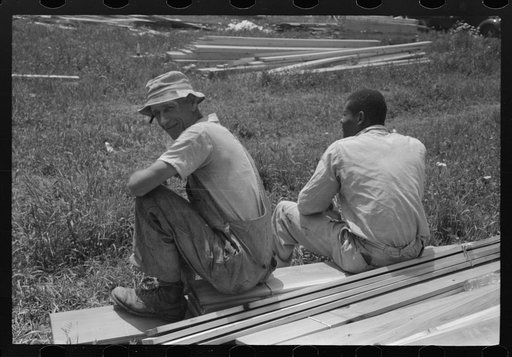 Untitled photo, possibly related to: Workers during lunch hour putting up prefabricated defense houses managed by FSA (Farm Security Administration), Hartford, Connecticut