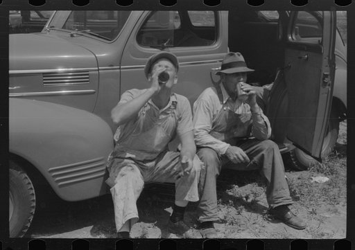 Untitled photo, possibly related to: Workers during lunch hour putting up prefabricated defense houses managed by FSA (Farm Security Administration), Hartford, Connecticut