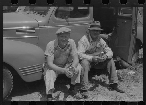 Untitled photo, possibly related to: Workers during lunch hour putting up prefabricated defense houses managed by FSA (Farm Security Administration), Hartford, Connecticut
