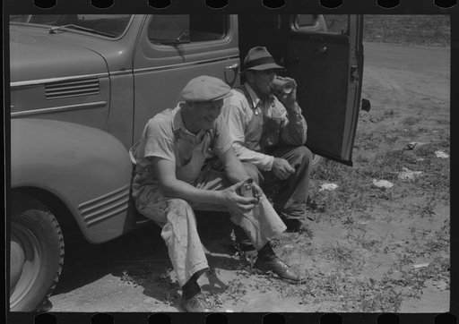 Untitled photo, possibly related to: Workers during lunch hour putting up prefabricated defense houses managed by FSA (Farm Security Administration), Hartford, Connecticut