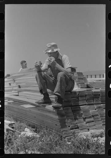 Untitled photo, possibly related to: Workers during lunch hour putting up prefabricated defense houses managed by FSA (Farm Security Administration), Hartford, Connecticut