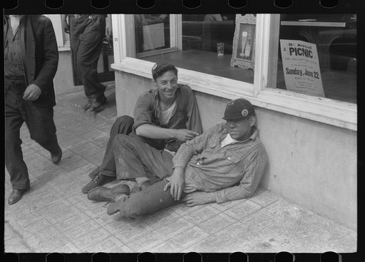 Workers lounging around town and waiting for a lift home at afternoon change of shift of Electric Boat Works, Groton, Connecticut