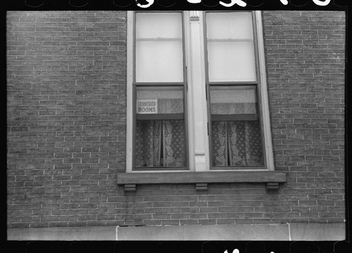 Signs in window, evidence of boom town and crowded housing conditions. Hartford, Connecticut