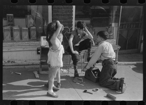Children shining shoes on street corner, Hartford, Connecticut