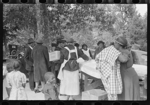Cleaning up and visiting after outdoor picnic at an all-day ministers and deacons meeting. Near Yanceyville, Caswell County, North Carolina