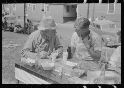 Brunswick stew dinner in front of the tobacco warehouse on opening day of the auctions. Prepared by Parent Teachers Association of Prospect Hill, to raise money for a new gymnasium for the Prospect Hill Consolidated School in Caswell County, North Carolina