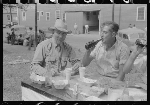 Untitled photo, possibly related to: Brunswick stew dinner in front of the tobacco warehouse on opening day of the auctions. Prepared by Parent Teachers Association of Prospect Hill, to raise money for a new gymnasium for the Prospect Hill Consolidated School in Caswell County, North Carolina