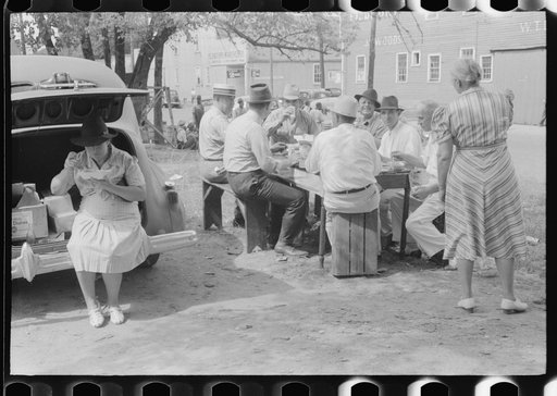 Untitled photo, possibly related to: Brunswick stew dinner in front of the tobacco warehouse on opening day of the auctions. Prepared by Parent Teachers Association of Prospect Hill, to raise money for a new gymnasium for the Prospect Hill Consolidated School in Caswell County, North Carolina