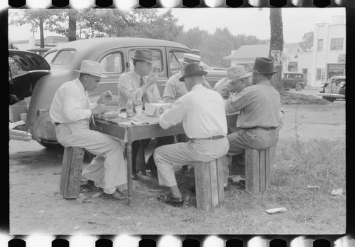 Untitled photo, possibly related to: Brunswick stew dinner in front of the tobacco warehouse on opening day of the auctions. Prepared by Parent Teachers Association of Prospect Hill, to raise money for a new gymnasium for the Prospect Hill Consolidated School in Caswell County, North Carolina