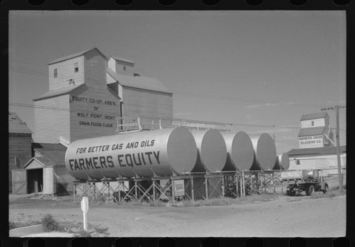 Untitled photo, possibly related to: Farmers Equity Coop. Grain elevators and oil tanks, Wolf Point, Montana