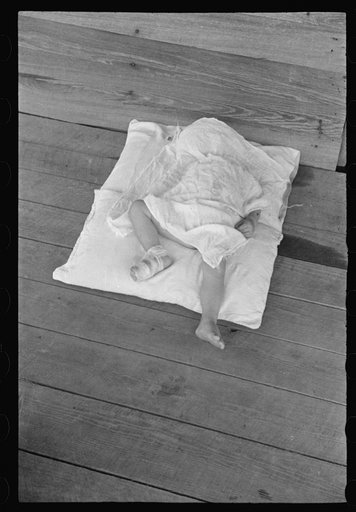 Untitled photo, possibly related to: Squeakie asleep (Othel Lee Burroughs). Son of a Hale County, Alabama cotton sharecropper