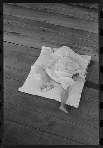 Squeakie asleep (Othel Lee Burroughs). Son of a Hale County, Alabama cotton sharecropper