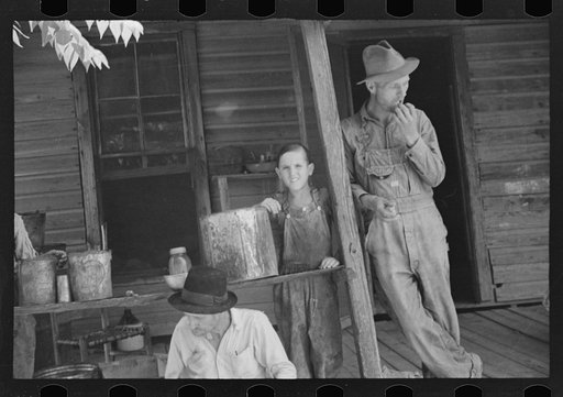 Bud Fields, Tengle boy, and Floyd Burroughs on Frank Tengle's porch, Hale County, Alabama