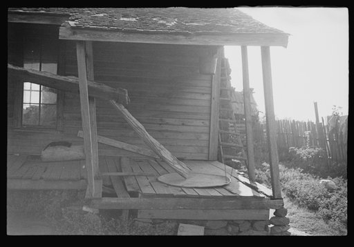 Untitled photo, possibly related to: Porch of a sharecropper's cabin, Hale County, Alabama