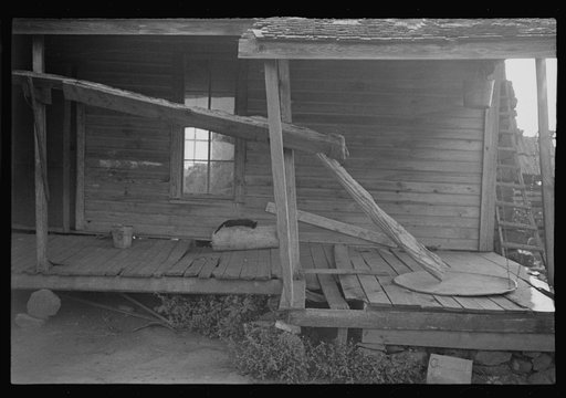 Porch of a sharecropper's cabin, Hale County, Alabama