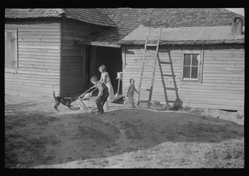 Untitled photo, possibly related to: Burroughs children playing in the yard, Hale County, Alabama
