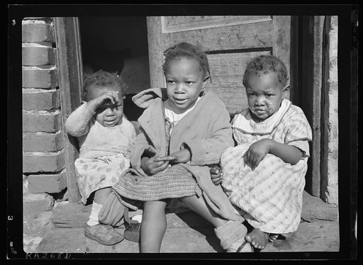 Negro youngsters in doorway of alley dwelling. Washington, D.C.