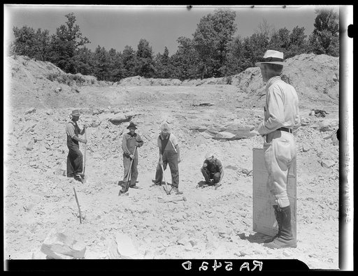 Farmers resettled on Skyline Farms, Alabama, at work in sand quarry under supervision of project manager
