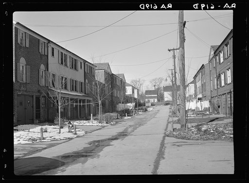 Radburn, New Jersey, a privately financed model town which furnished some of the ideas for the Suburban Resettlement Administration's Greenbelt towns. A roadway, not a thoroughfare, back of a unit of houses